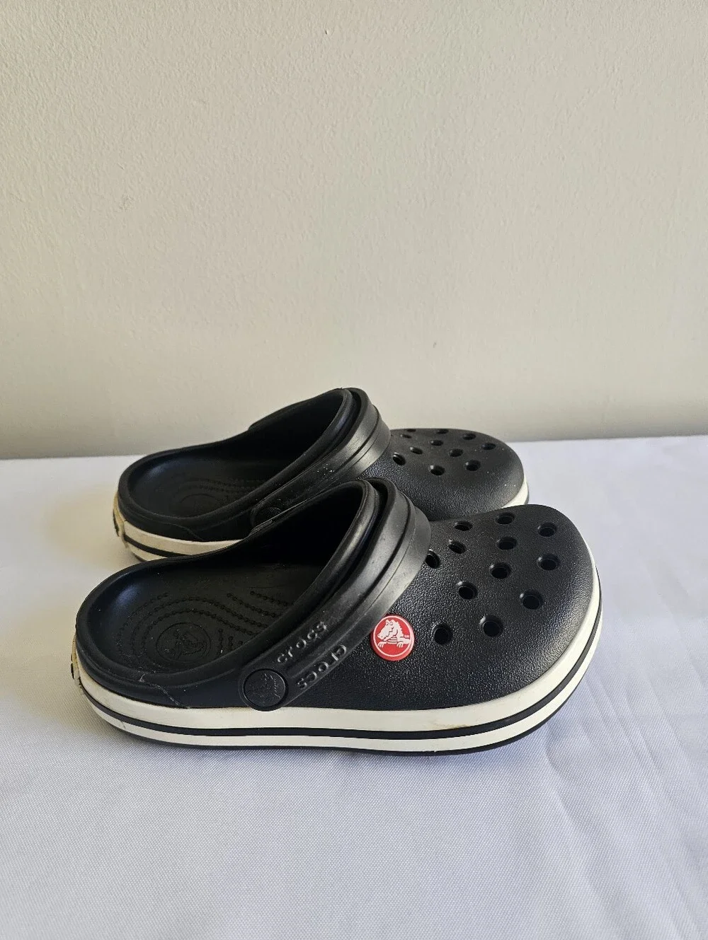 CROCS Kids Black Clogs with White Stripe